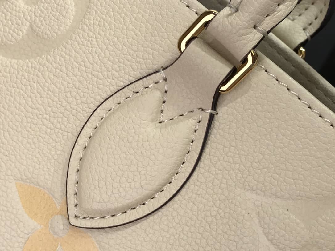 L0vis Vvtt0n On the Go MM Monogram Empreinte Two-way Tote Replica Apricot M45717