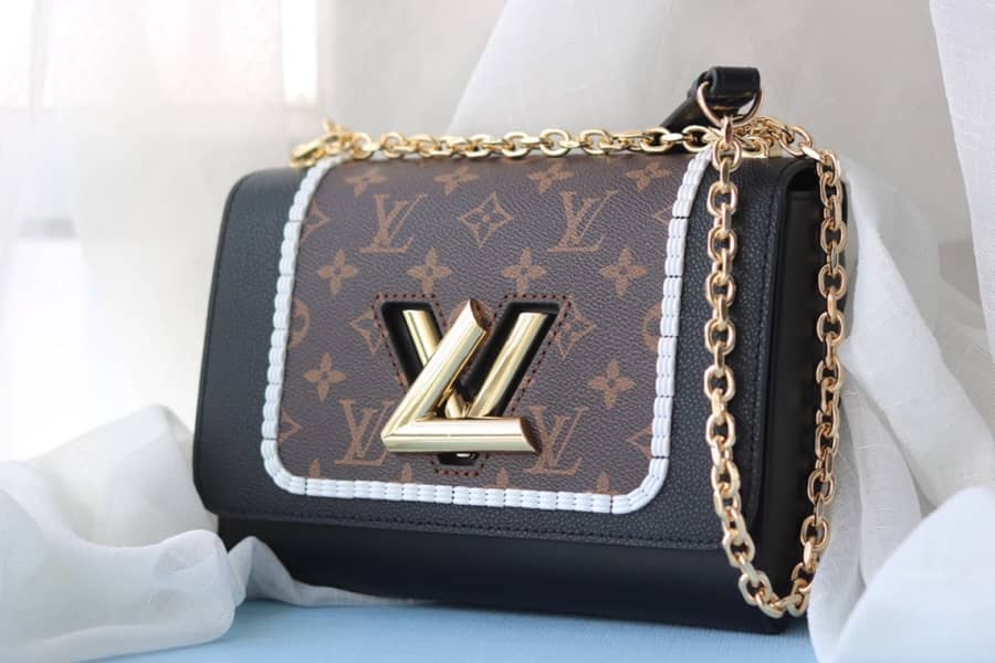 L0vis Vvtt0n Textured Epi Leather Twist Series Bag